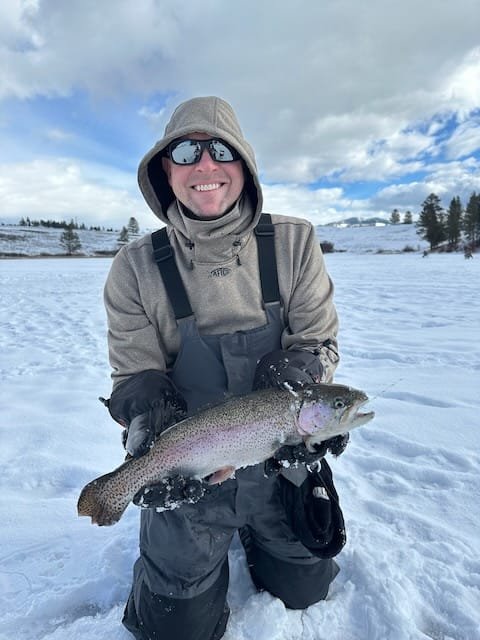 Scott with a trout he caught ice fishing