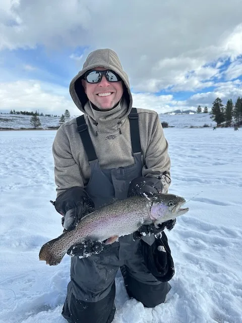 Scott with a trout he caught ice fishing